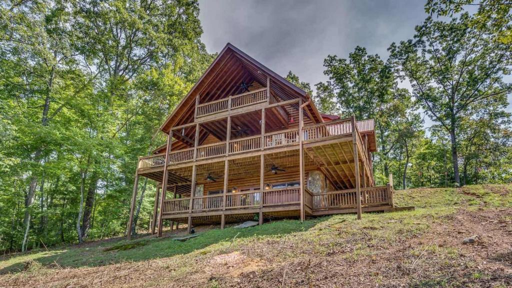 a large wooden house on top of a hill at Black Bear Lodge in Blue Ridge
