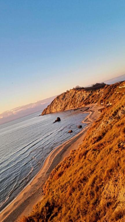 a view of a sandy beach with the ocean at Casa in Durrës