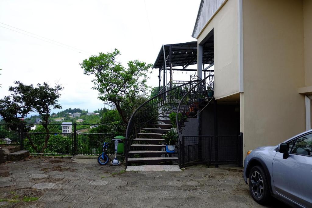 a stairway leading up to a building with a staircase at Tsikhisdziri House 3 in Ts'ikhisdziri