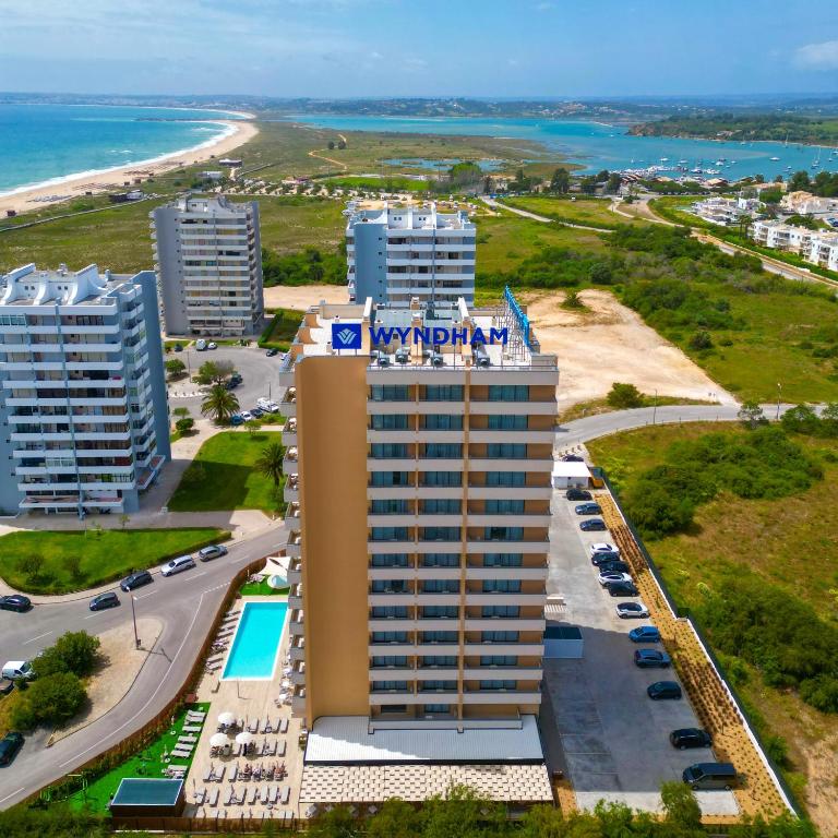 an aerial view of a hotel in front of the beach at Wyndham Residences Alvor Beach in Alvor