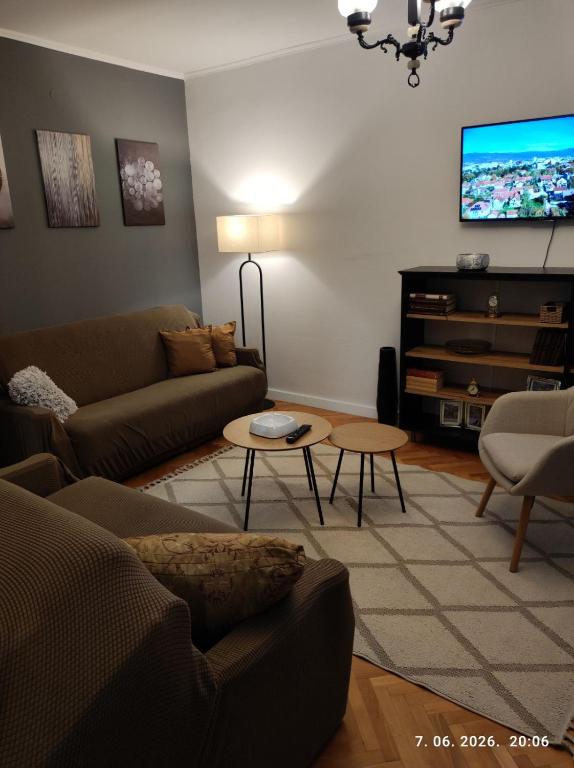 a living room with a couch and a tv at Ksandra in Topla