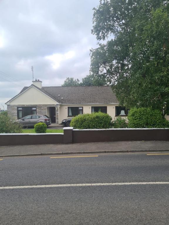 a house on the side of a road at Cistin Bheag Áine in Ballygawley