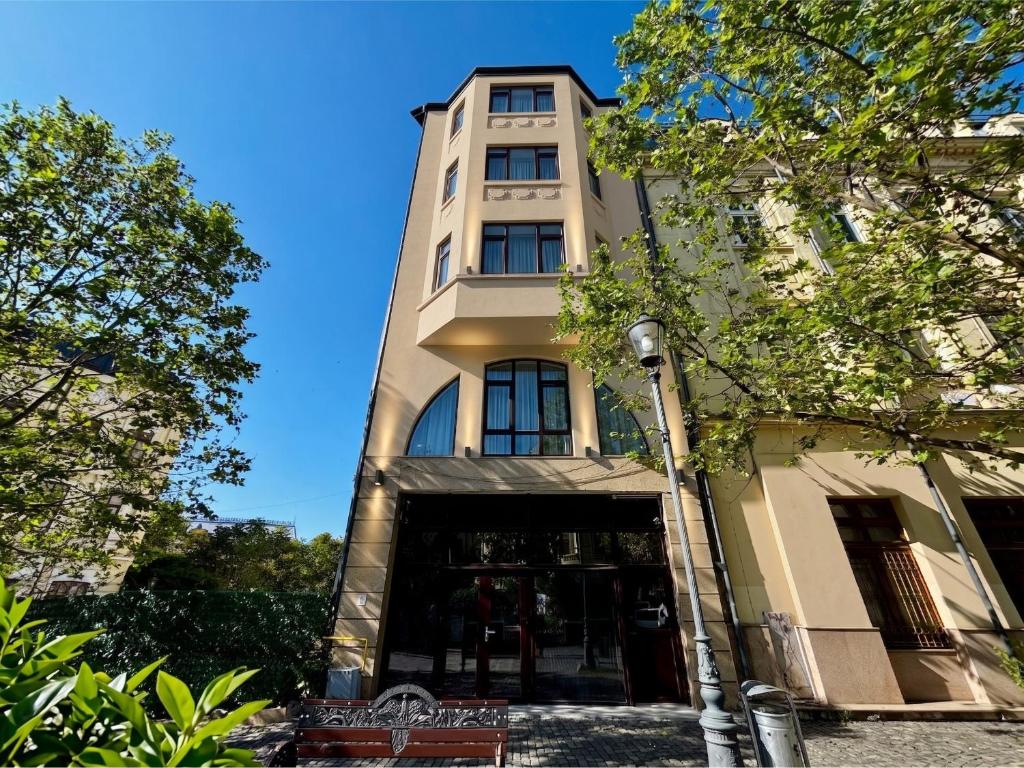 a tall building with a door in front of it at Lumen - Bright Stay in Bucharest in Bucharest