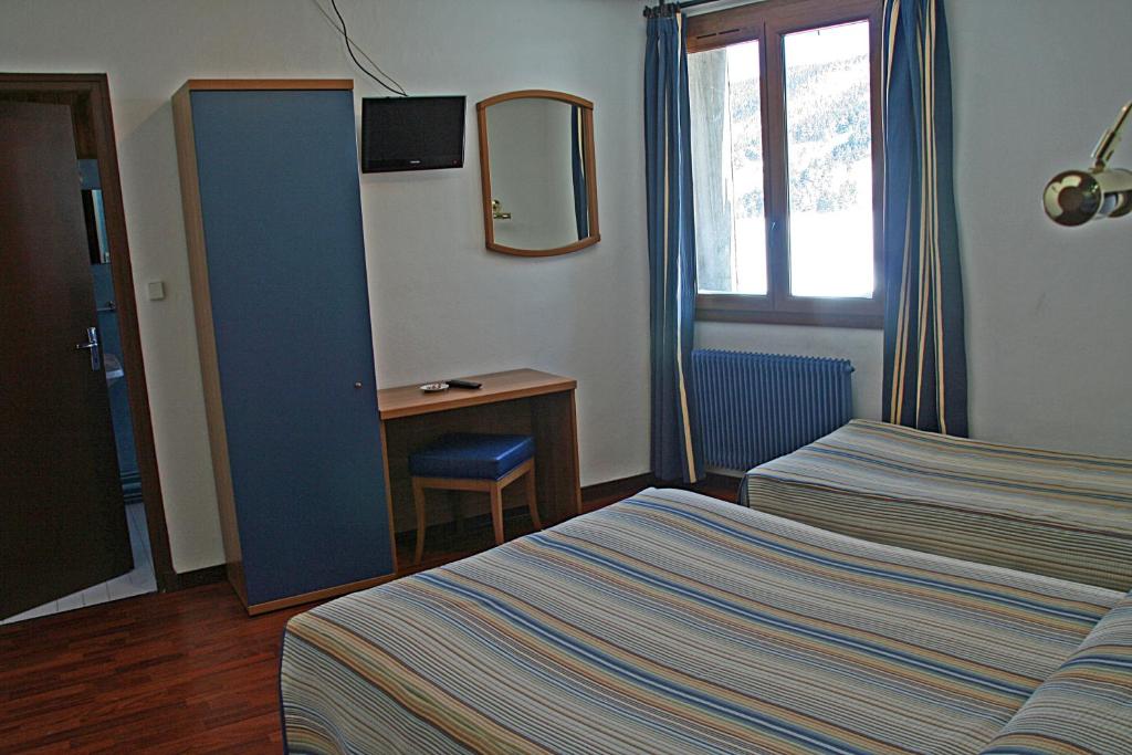 Postel nebo postele na pokoji v ubytování Hotel La Belle Aude