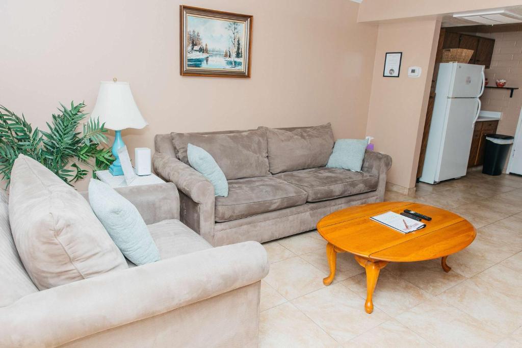 a living room with a couch and a table at NEW Desert Bloom Hideaway in Green Valley