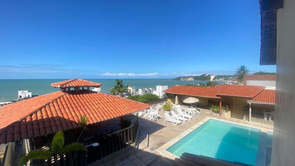 an aerial view of a house with a swimming pool at Ponta Negra Palace in Natal
