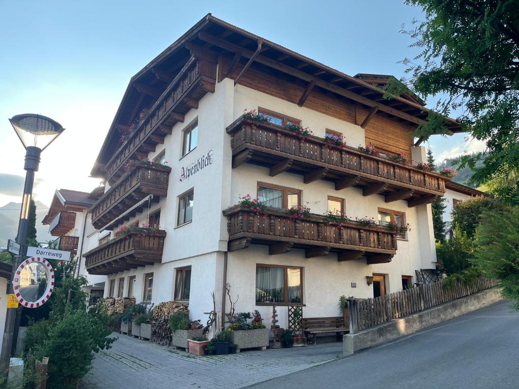 a building with balconies on the side of it at Haus Alpenblick in Serfaus