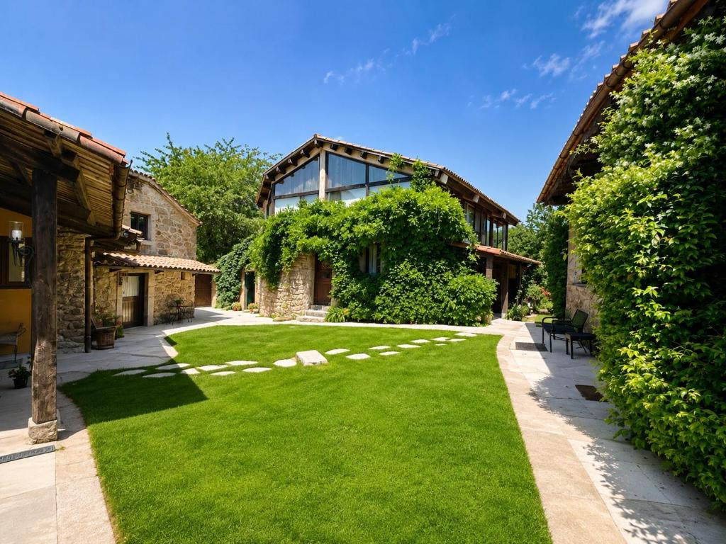 a garden with green grass in front of a building at Elemergia in Irijoa