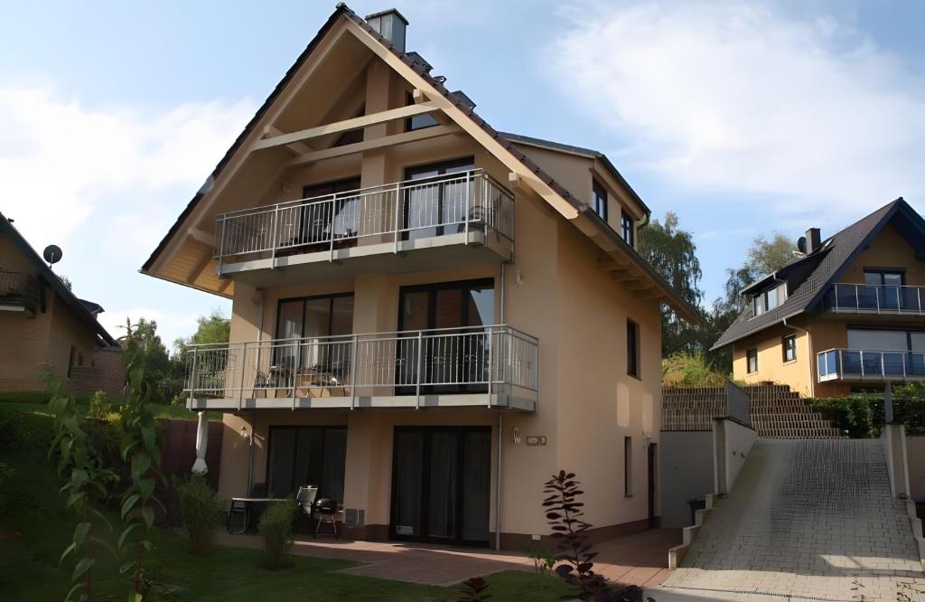 a house with balconies on the side of it at Haus u8 in Röbel