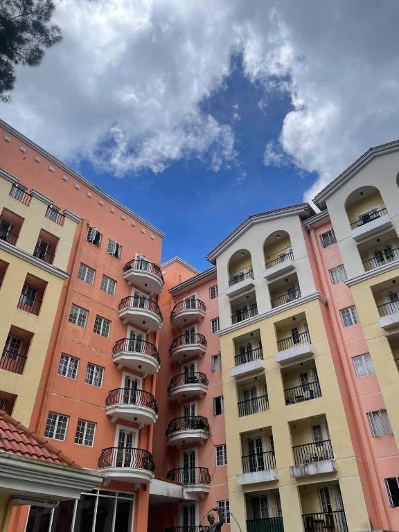 a group of buildings with balconies on them at D' Cozy Pines Suites in Baguio