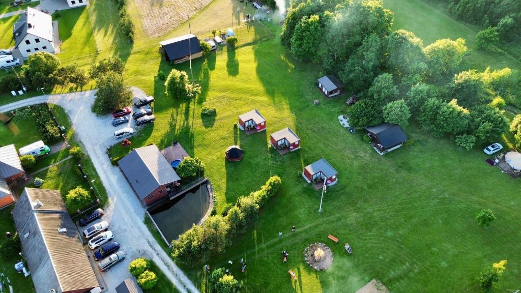 an aerial view of a park with parked cars at Pühajõe Puhkemaja in Pühajõe
