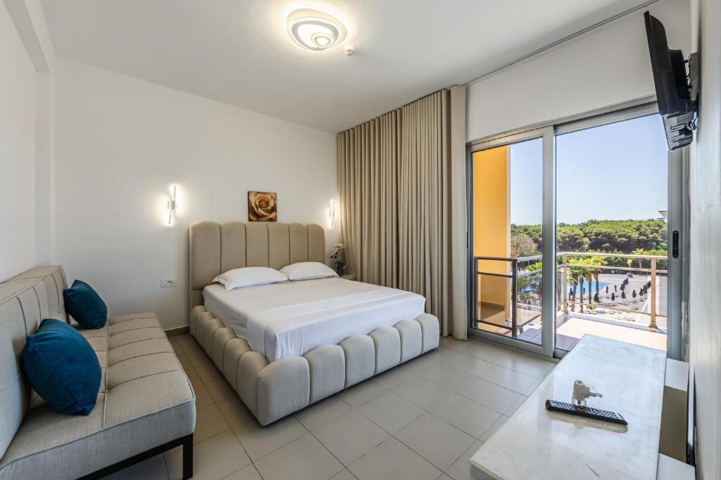 Intea Hotel Durres tesisinde bir odada yatak veya yataklar