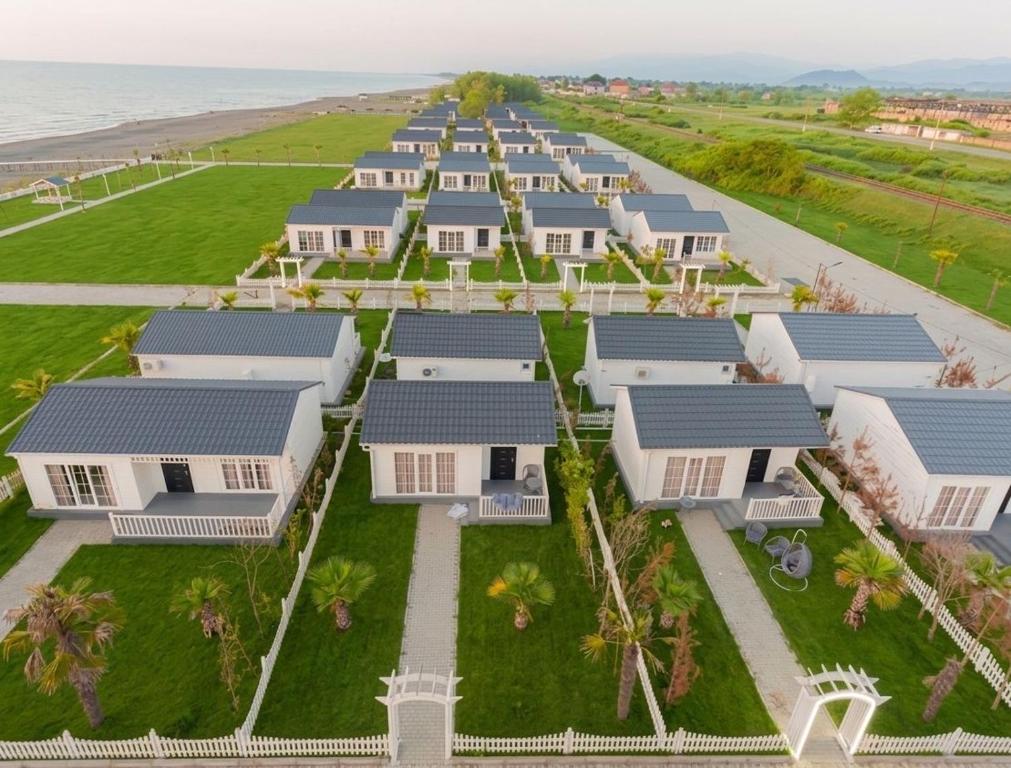 an aerial view of a row of houses on the beach at Astalanya City in Astara