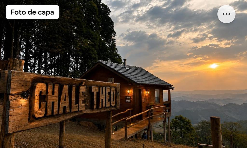a cabin in the mountains with a sign that reads call this at Chalé Theo - Para momentos únicos in Camanducaia