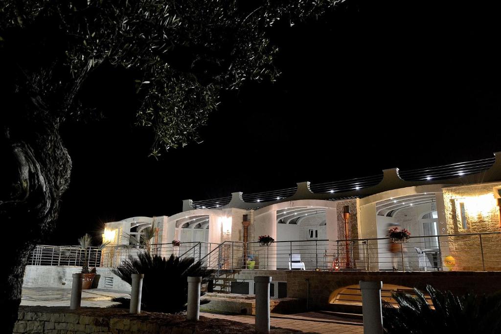 a building at night with lights on it at Casale Porto Contessa in Polignano a Mare