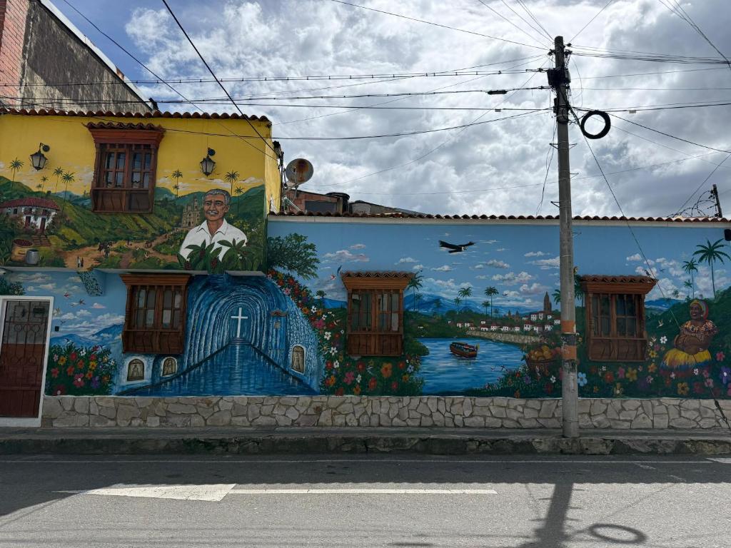 a mural on the side of a building at Hospedaje El Encanto in Zipaquirá