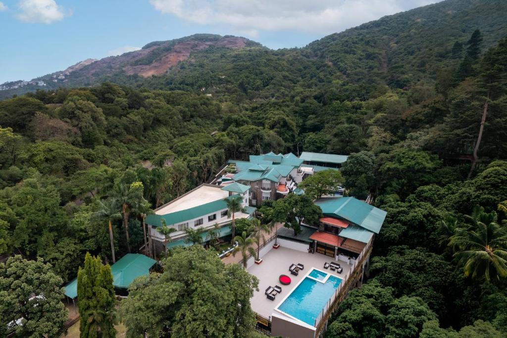 an aerial view of a resort with a swimming pool at Velvet Resort Khandala in Khandāla