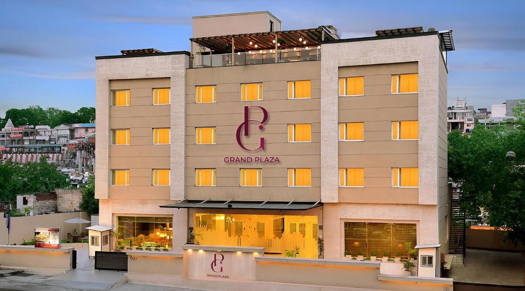 a building with a sign on the side of it at Grand Plaza Jammu in Jammu