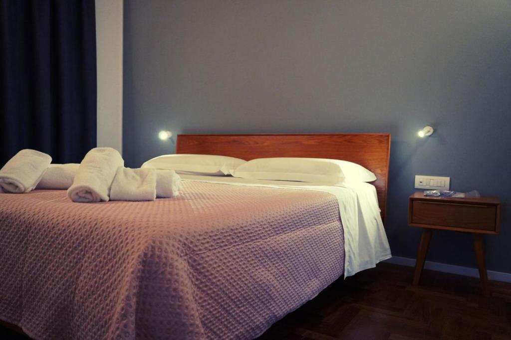 a bedroom with two beds with towels on them at Aurora Lucana in Matera