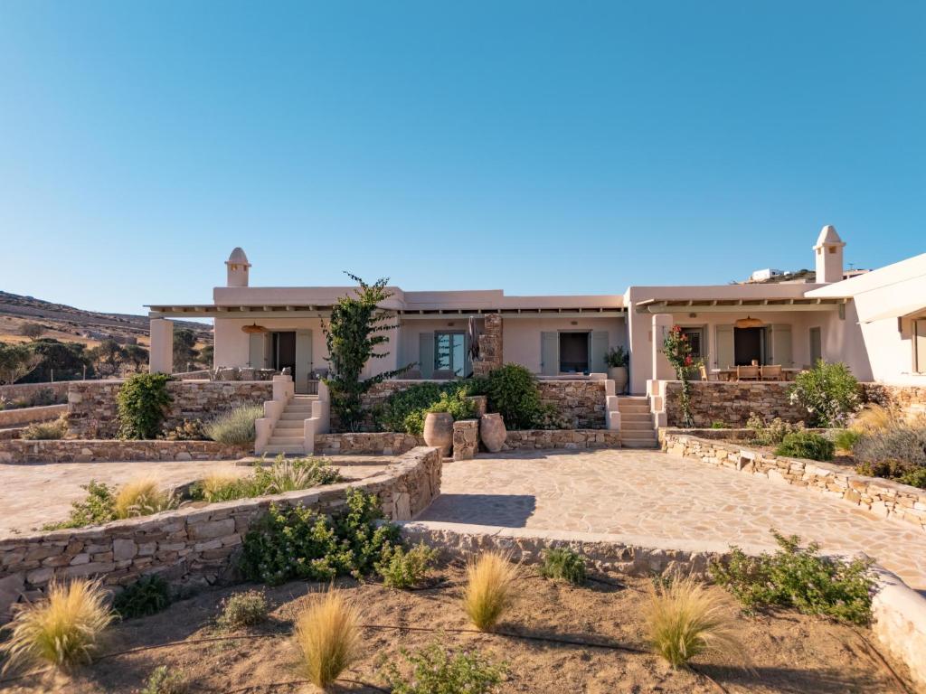 a house in the desert with a stone wall at Mikres Cyclades - Koufonisia House in Koufonisia