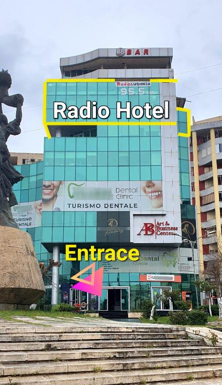 a building with a radio hotel sign on it at RADIO HOTEL Lushnje in Lushnjë