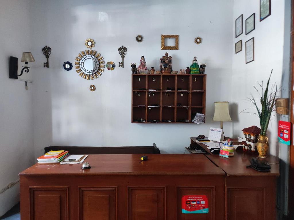 a room with a wooden desk in a room at Santa Beatriz in Lima