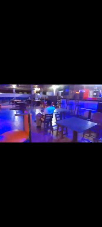 a blurry picture of a room with tables and chairs at Mtomo vision in Mtwapa