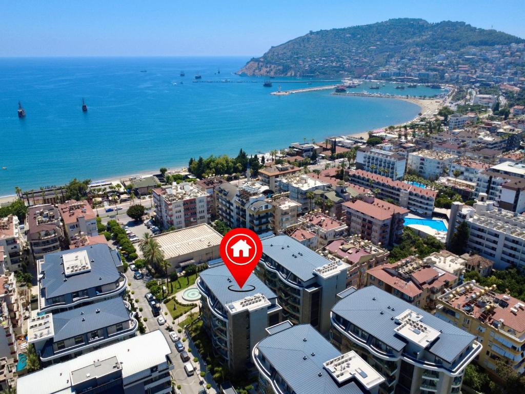 an aerial view of a city with a red sign at SA Apartments! Luxury Residence with Private Beach in Alanya