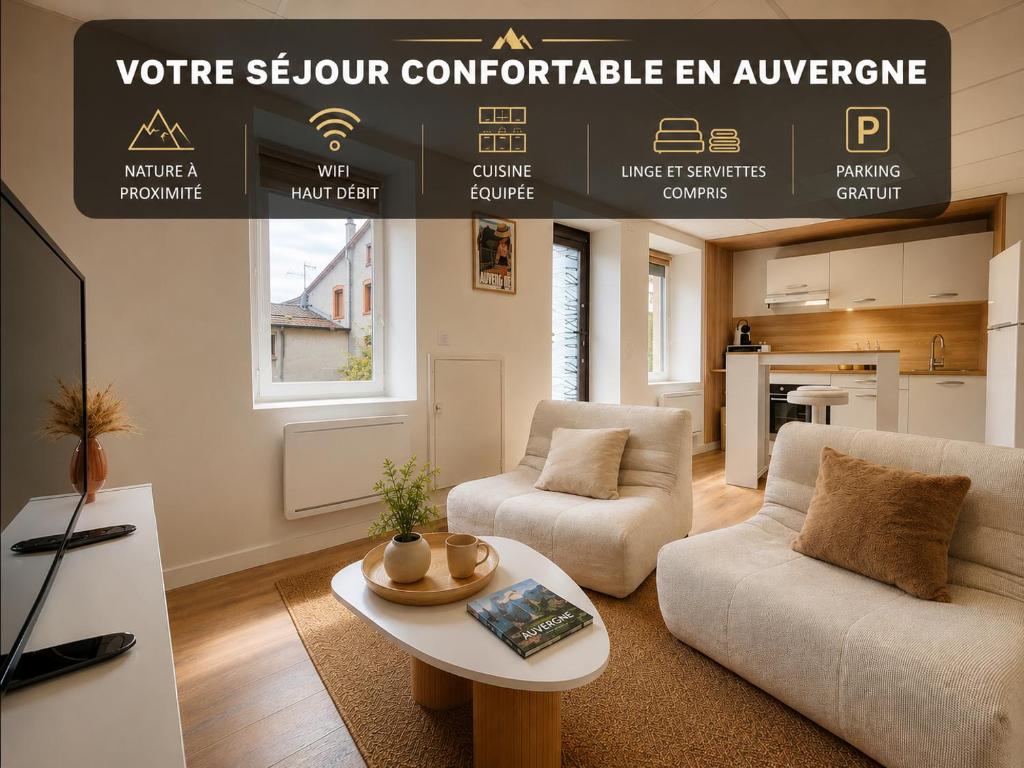 a living room with a couch and a table at La Maison De Colette in Lezoux