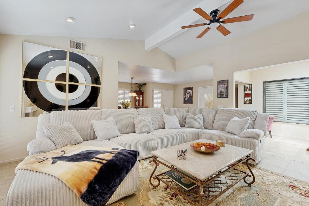 a living room with a couch and a table at Palm Paradise in Palm Desert