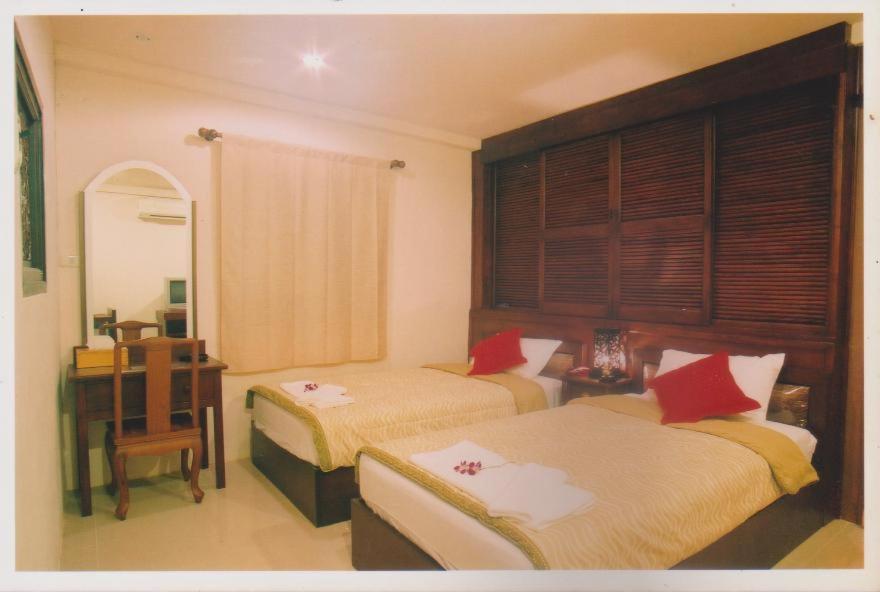 Llit o llits en una habitació de Bautong Lodge