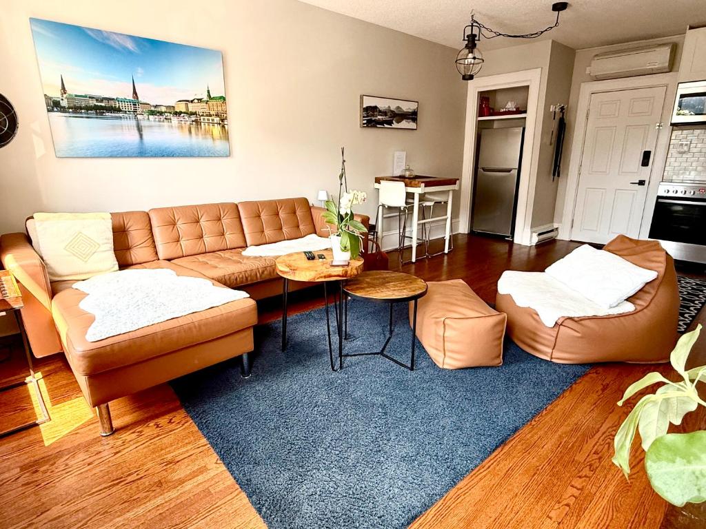 a living room with a couch and a table at Stylish Heritage Gem facing Stewart Park and Town Hall in Perth