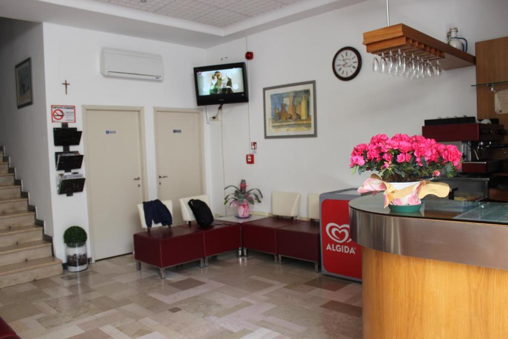 TV a/nebo společenská místnost v ubytování Hotel Amados