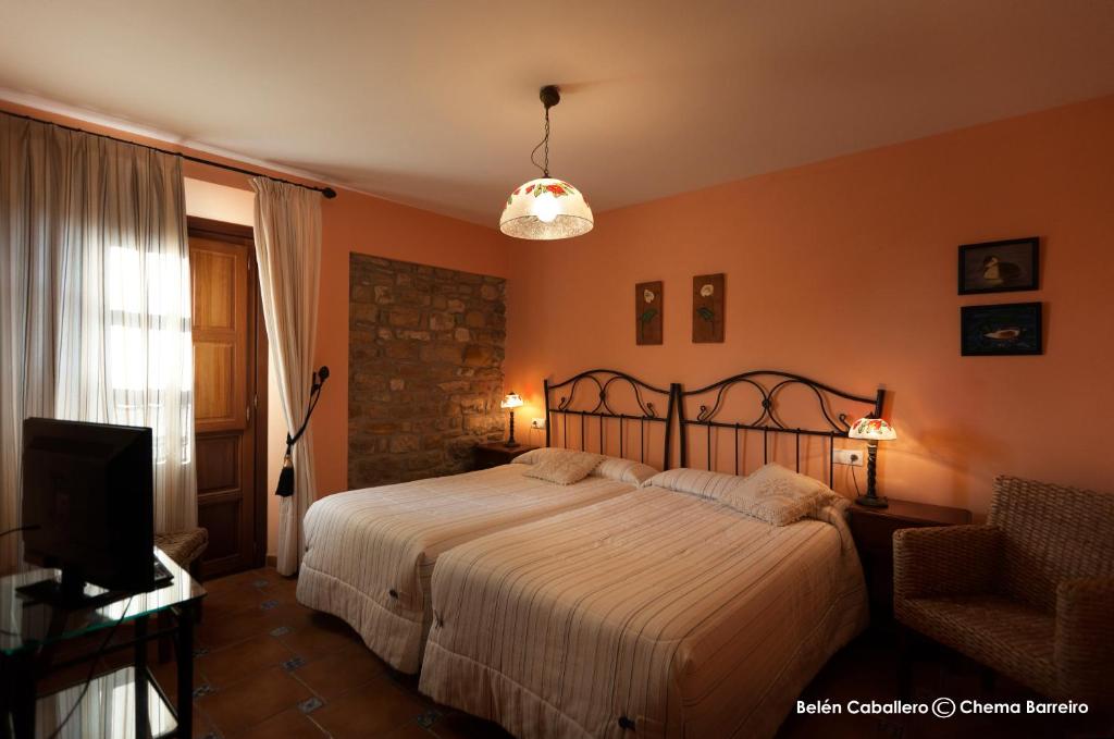Postel nebo postele na pokoji v ubytování La Casona de Quintes