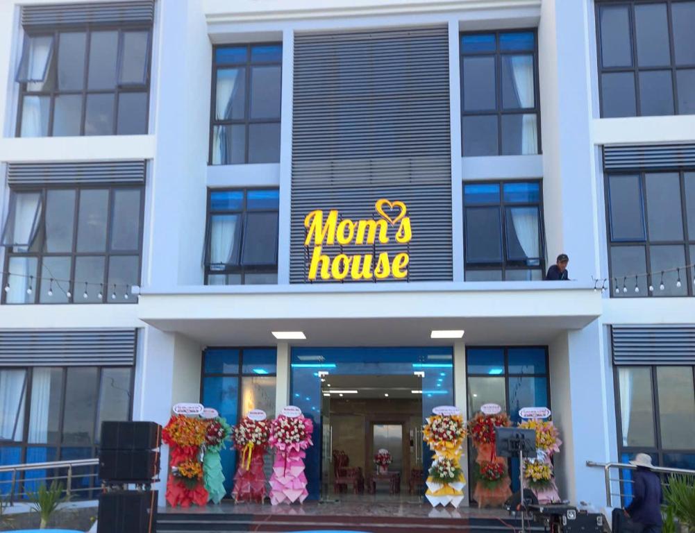 a mom house building with a sign on it at Mom's house Lý Sơn in An Vĩnh Phướng