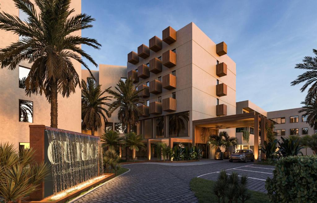 a rendering of a building with palm trees in front at Casa de Sada Algarve Beach Resort, Curio Collection by Hilton in Armação de Pêra