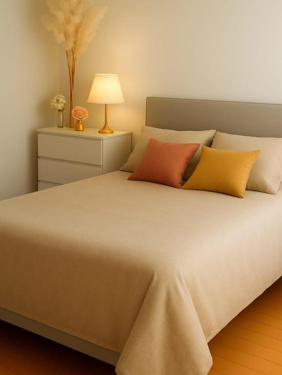 a bedroom with a large bed with two pillows at Mountain view in Martigny-Ville