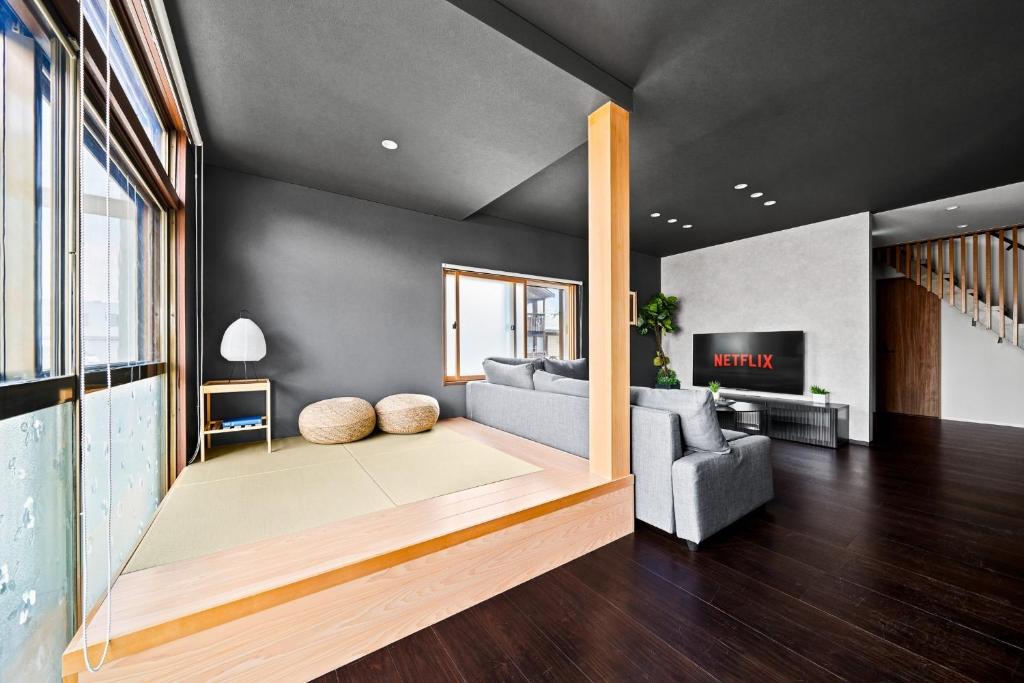 a living room with a couch and a fireplace at VIOLET GARDEN - Vacation STAY 37201v in Furano