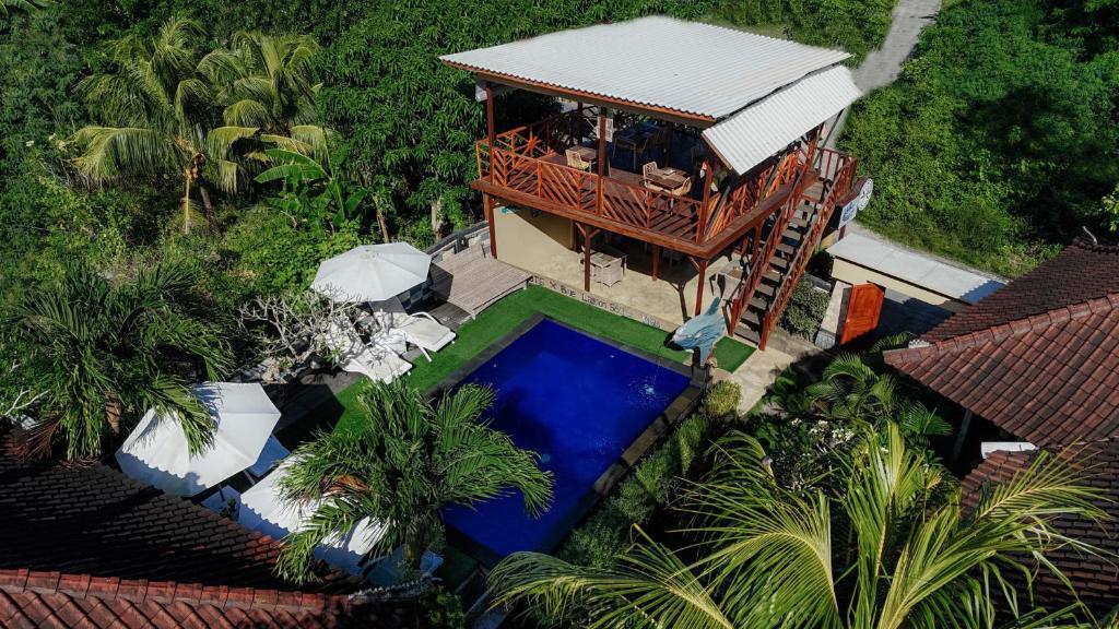 an overhead view of a house with a swimming pool at Blue Lagoon Secret Villas in Nusa Lembongan