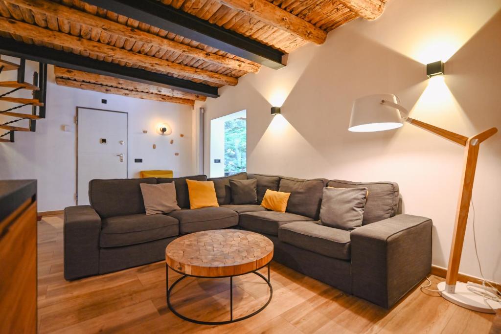 a living room with a couch and a table at Xalet Les Avellanes - hut 7335 in Arinsal