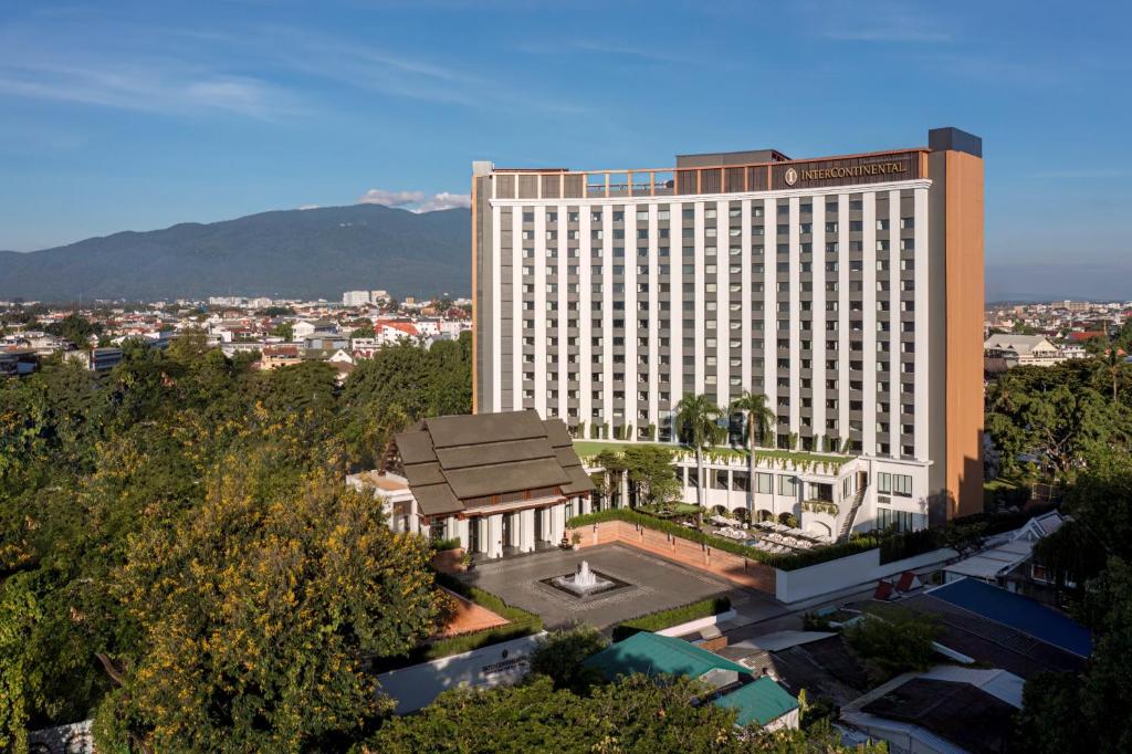 a large hotel building with a park in front of it at InterContinental Chiang Mai The Mae Ping in Chiang Mai