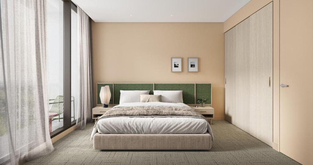 a bedroom with a bed and a large window at Oakwood Epping Melbourne in Epping