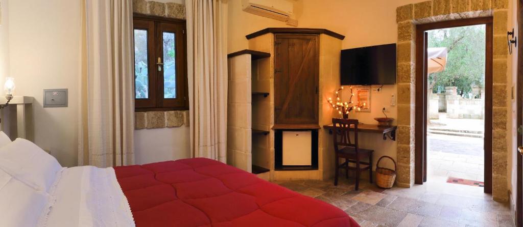 Postel nebo postele na pokoji v ubytování Masseria L'Uliveto Agri Resort