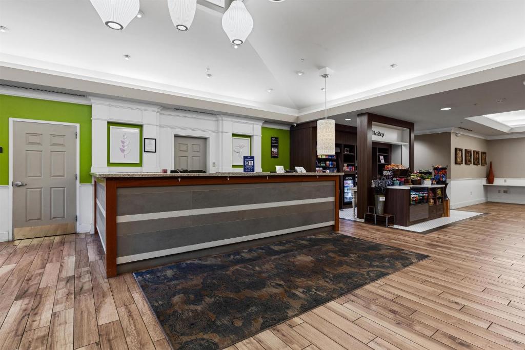 a lobby with a counter in a store at Hilton Garden Inn Ithaca in Ithaca