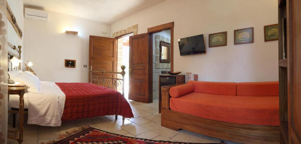 Postel nebo postele na pokoji v ubytování Masseria L'Uliveto Agri Resort