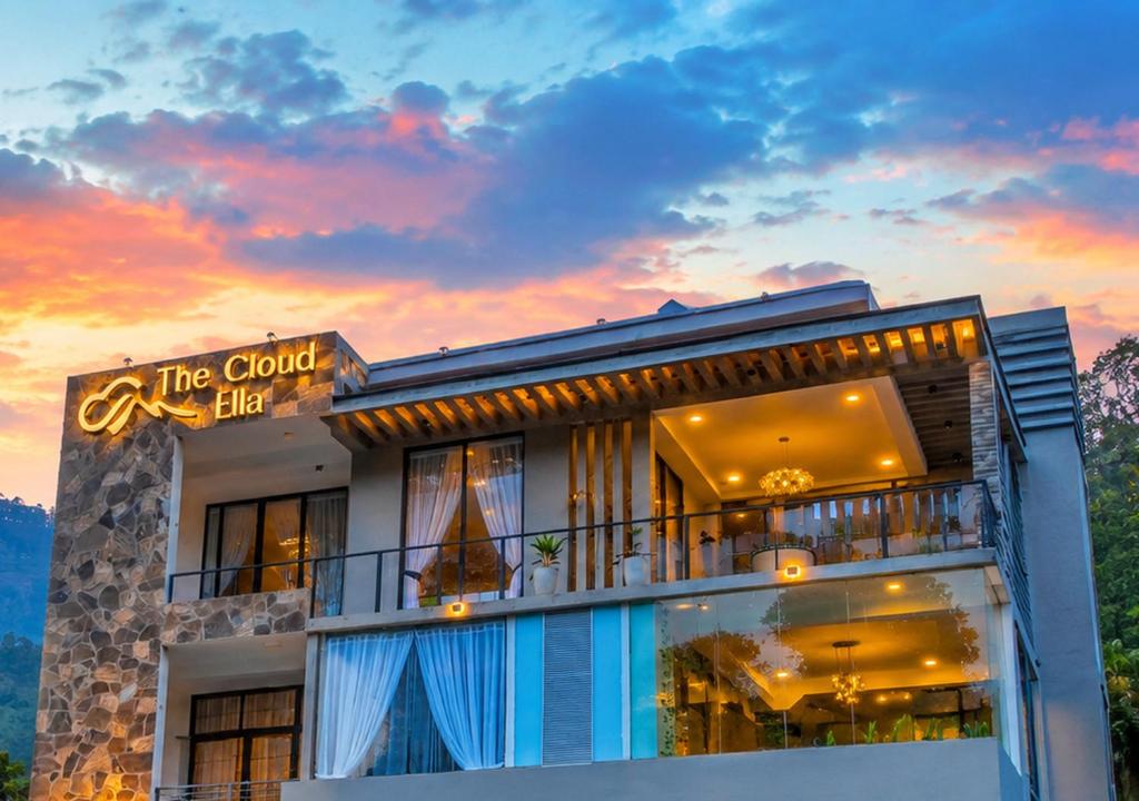 a building with a sunset in the background at The cloud ella in Ella