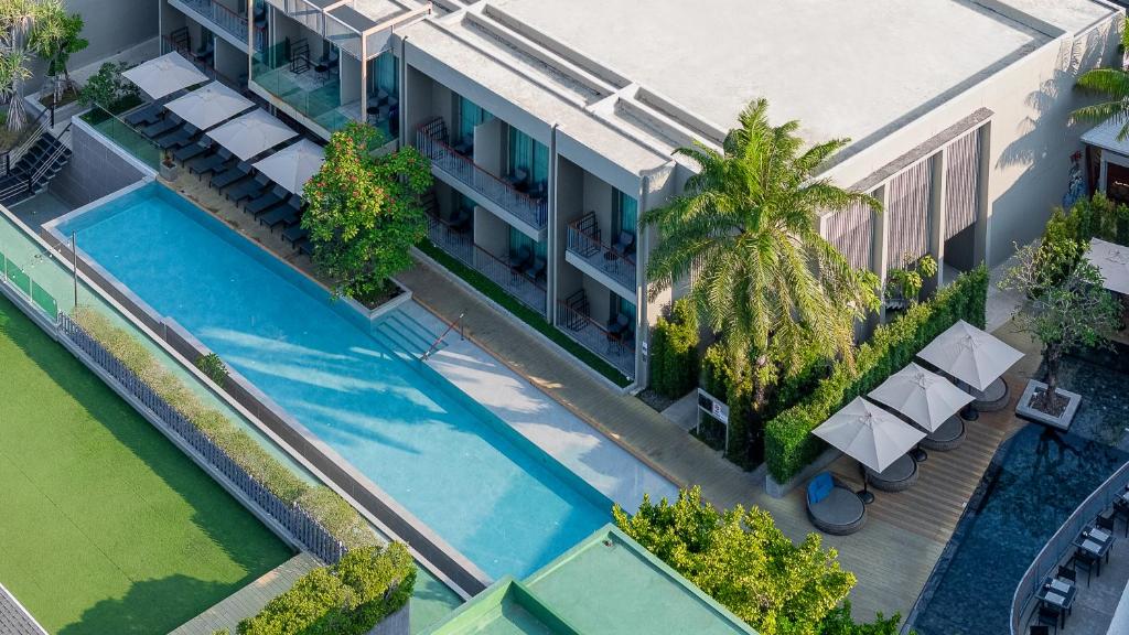 an overhead view of a building with a swimming pool at AtEase Phuket Patong in Patong Beach