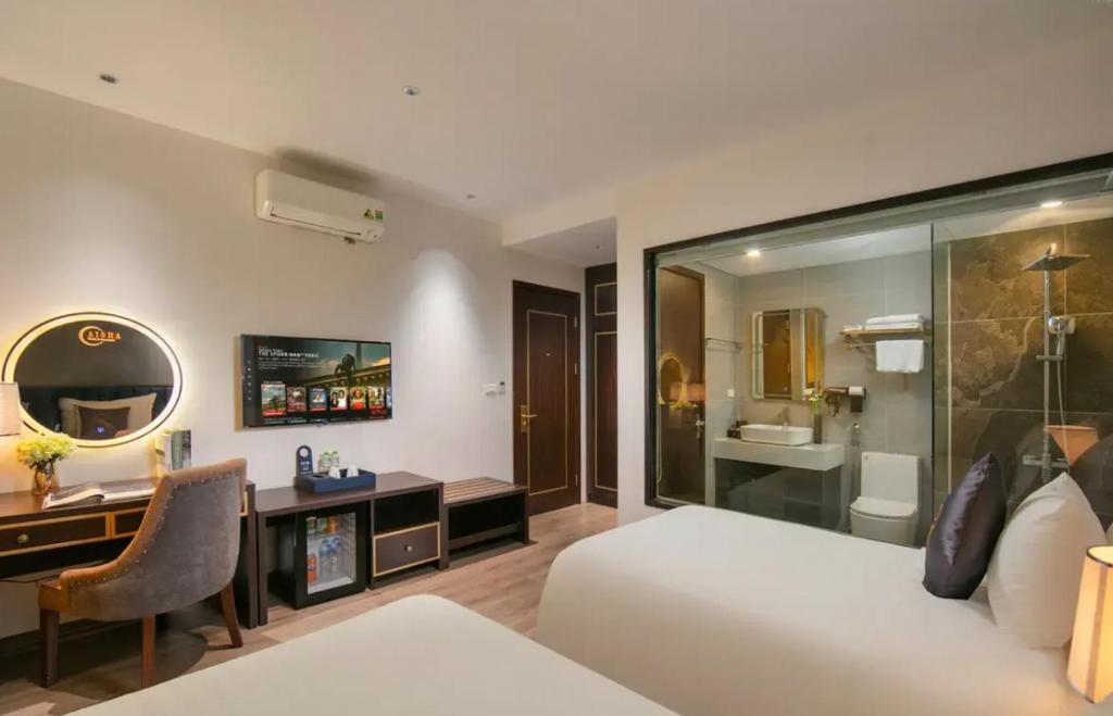 a bedroom with a bed and a desk and a mirror at Ryan Barnett home in Puerto Deseado
