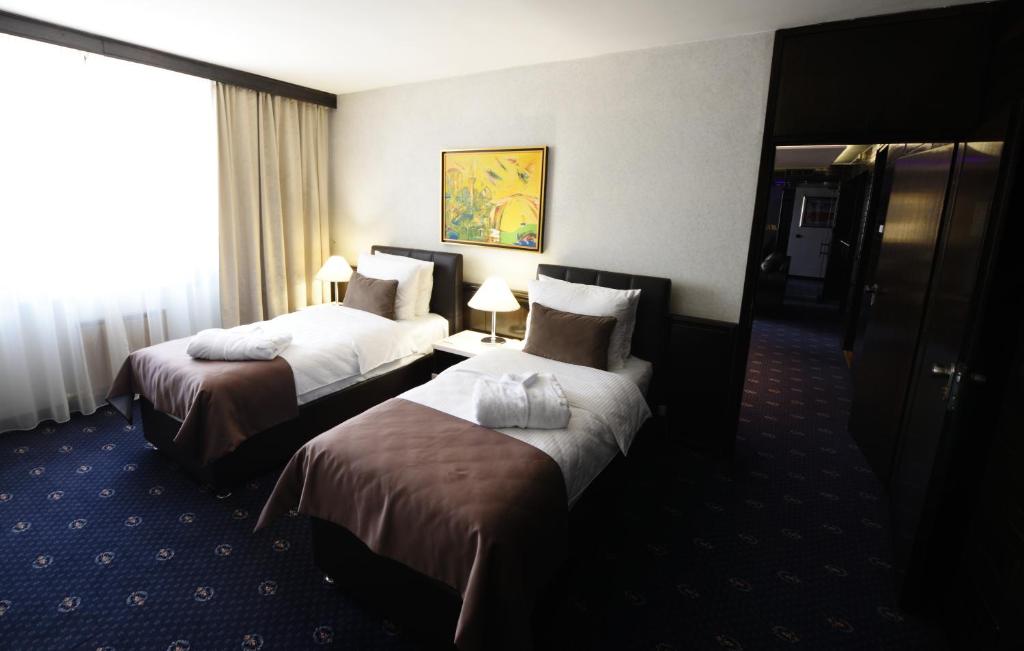 Postel nebo postele na pokoji v ubytování Hotel Holiday