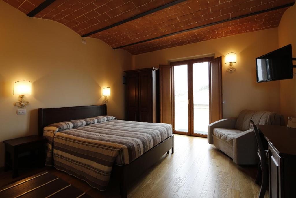 Posteľ alebo postele v izbe v ubytovaní Agriturismo Poggio Al Tufo